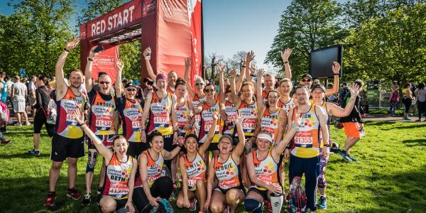 Leonard Cheshire runners celebrate at the end of the 2018 London Marathon