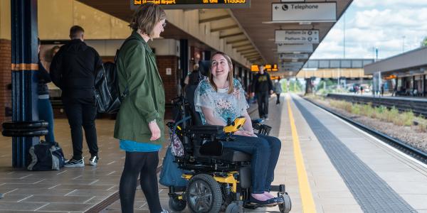 Campaigner Anna with staff member Danielle on the station platform at Leicester train station