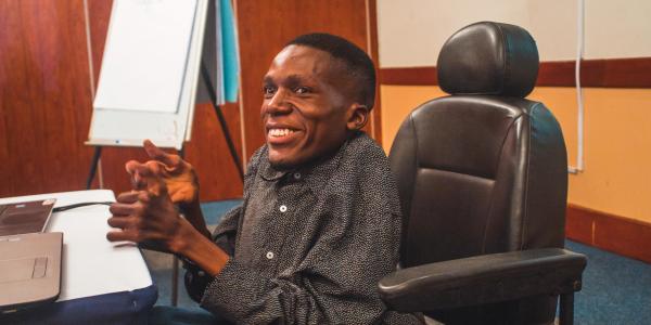 One of our citizen reporters sits smiling at the camera