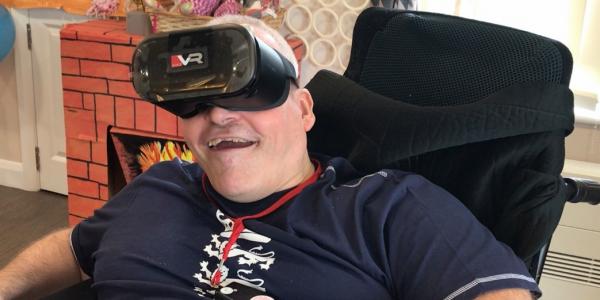 Chris testing out a VR headset at Hill House 