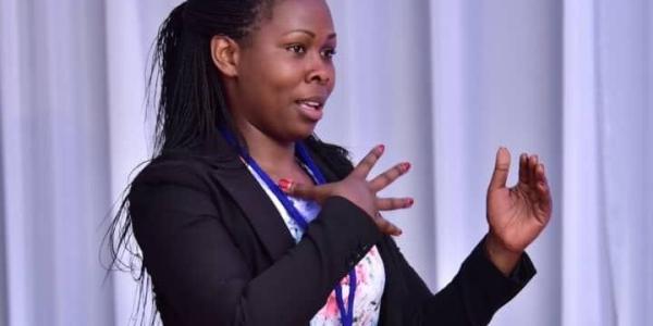 Ashura Michael from our young voices programme speaking at an event