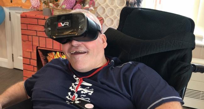 Chris testing out a VR headset at Hill House