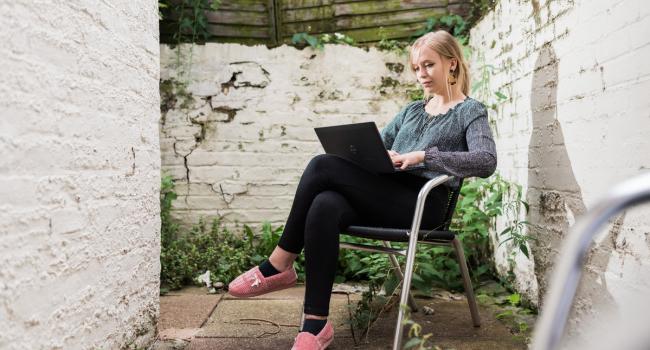 Grace, Change 100 intern, working from her garden