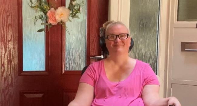 Kerry Thompson at home next to front door