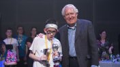 Rhodri Thompson receiving his award from Lord Peter Hain