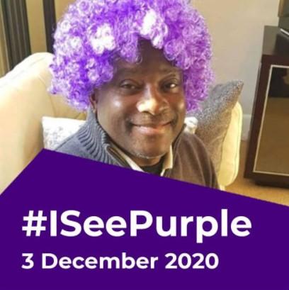 Mark Esho wearing a purple wig