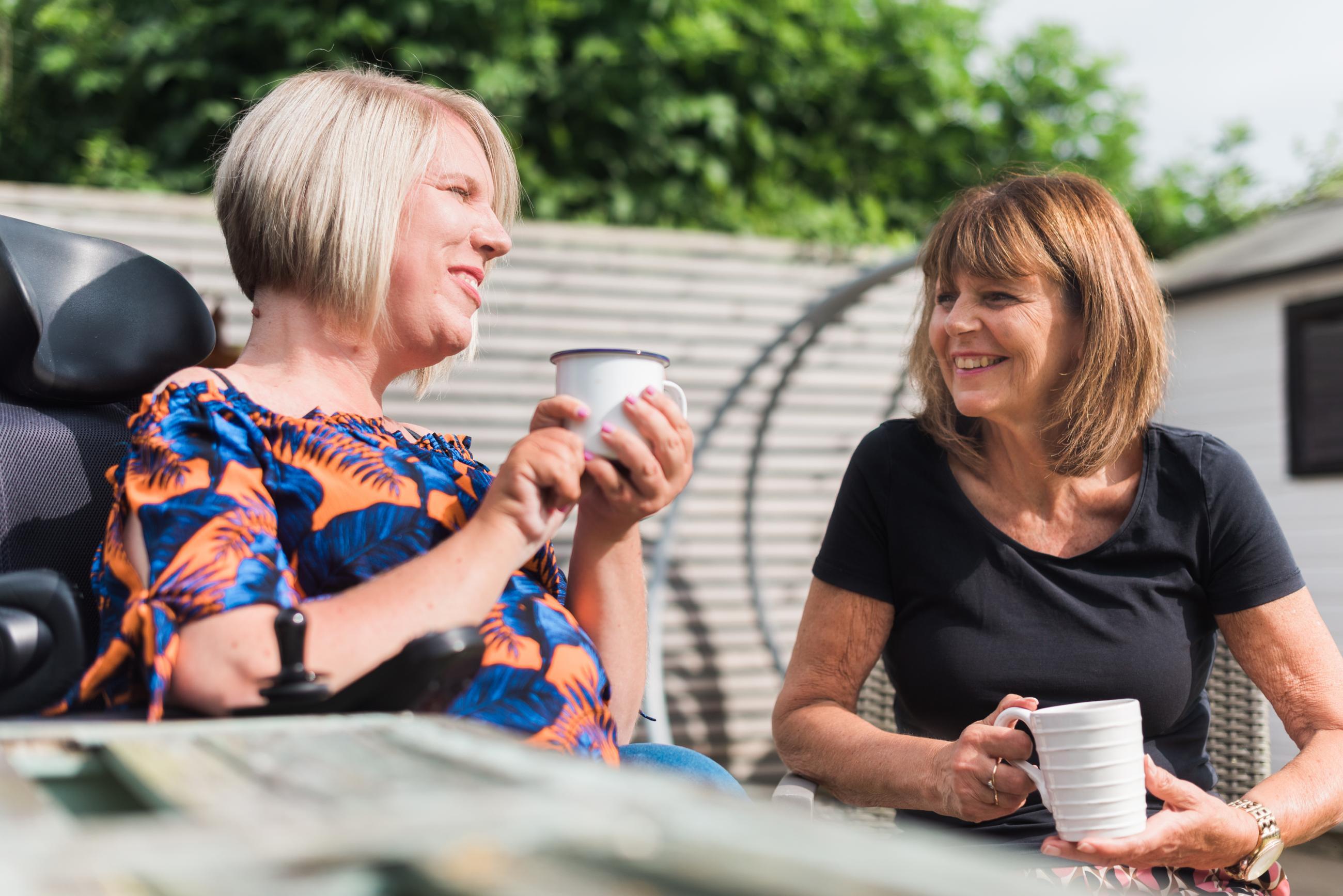 Chloe shares a cup of coffee with her mum