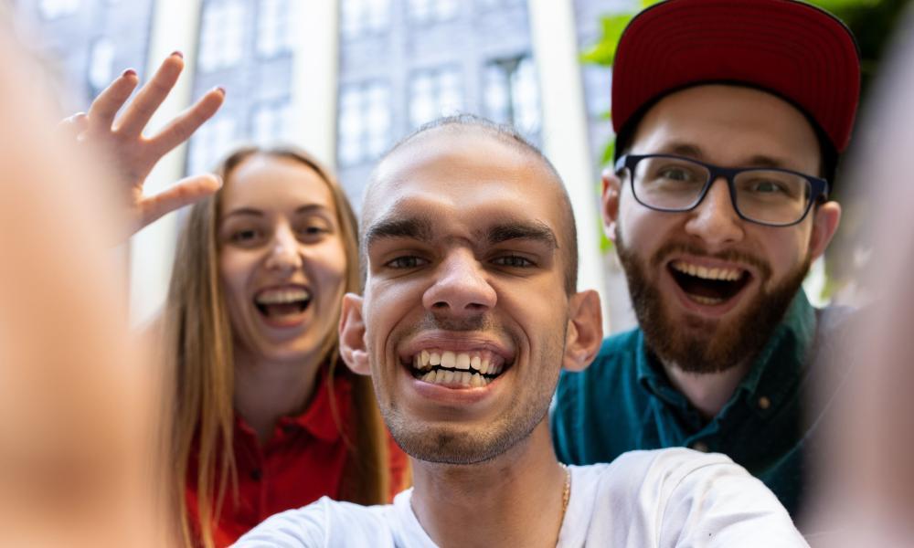 Photo of three people smiling