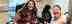 Sam a wheechair caucasian female with cropped red hair smiling in her chair alongside another Caucasian female with long wavy dark hair 