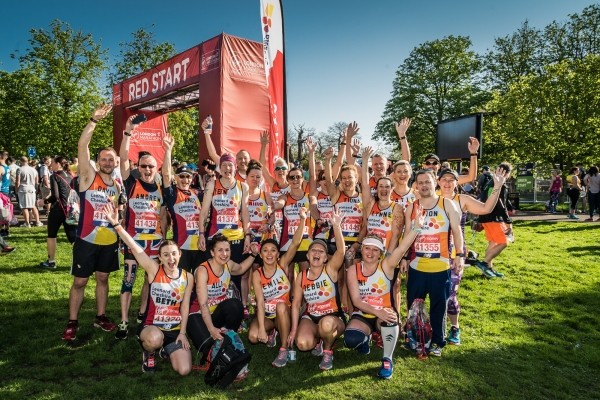 Leonard Cheshire runners celebrate at the end of the London Marathon