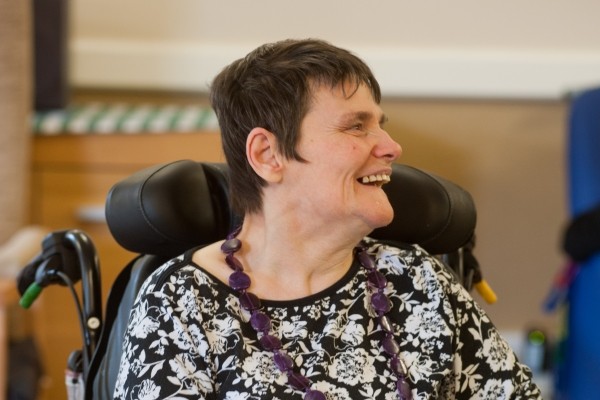 Resident playing dominoes at Dolywern