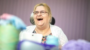 A woman laughing at one of our day centres
