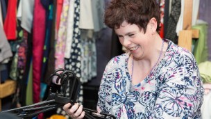 A woman working in a charity shop
