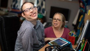 Graham, a resident at Godfrey Robinson House, with Amanda, a member of staff