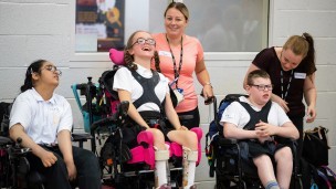 Young people in wheelchairs at a group event