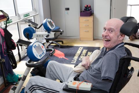 Resident on a exercise bike at Llanhennock lodge