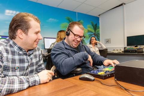 Two people using a computer