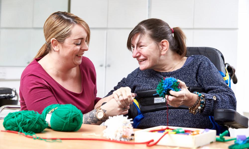 Resident sewing at Greenacres
