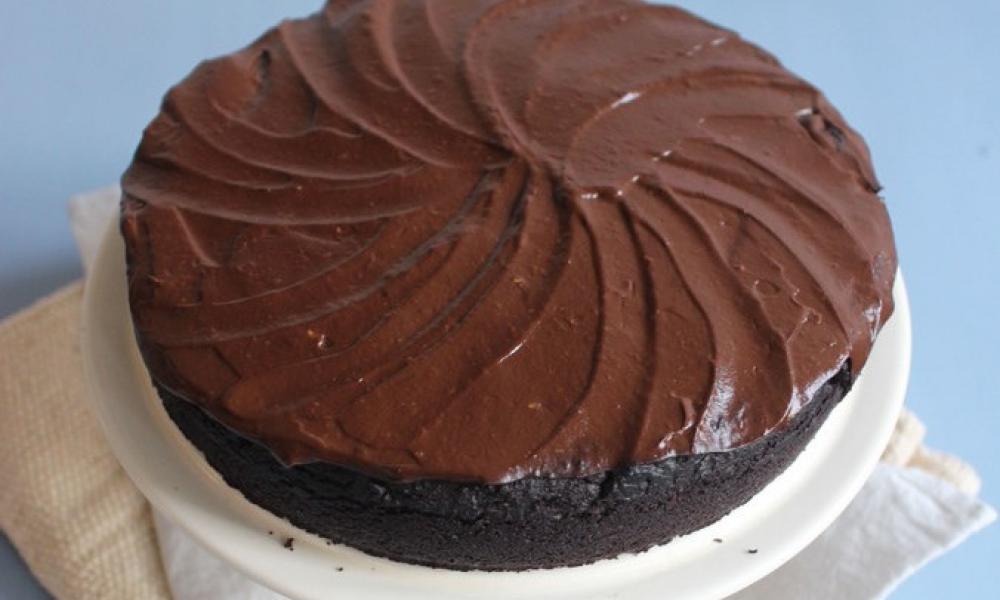 A Vegan Cocoa Cake sits on a table