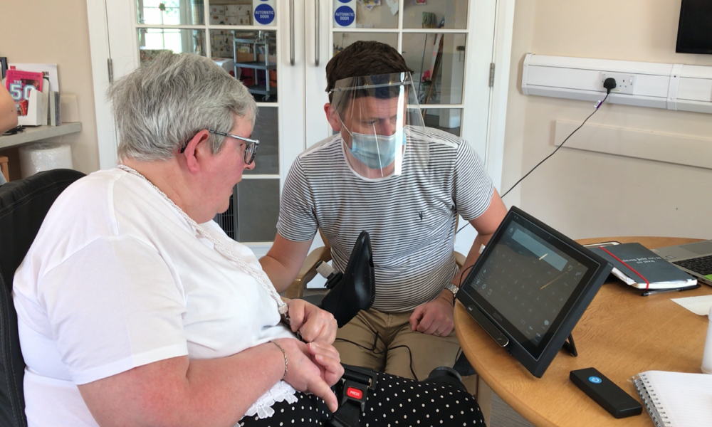 Bev using assistive tech at Hill House