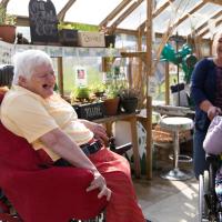 Resident at Heatherley in green house