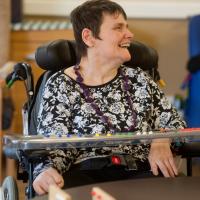 Resident playing dominoes at Dolywern