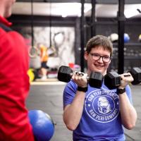 Someone lifting weights in a gym
