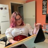 Natalie looks at a screen