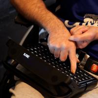 Resident using an accessible keyboard