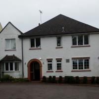 Exterior view of Firgrove with arched doorway and forecourt