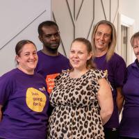 A group of Leonard Cheshire Workers stood together 
