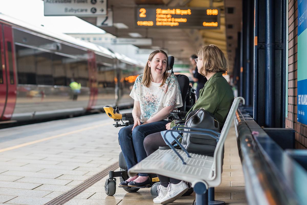 Anna, an accessible transport campaigner, with Danielle Mendel, External Communications Office, chatting on the platform of Leicester train station