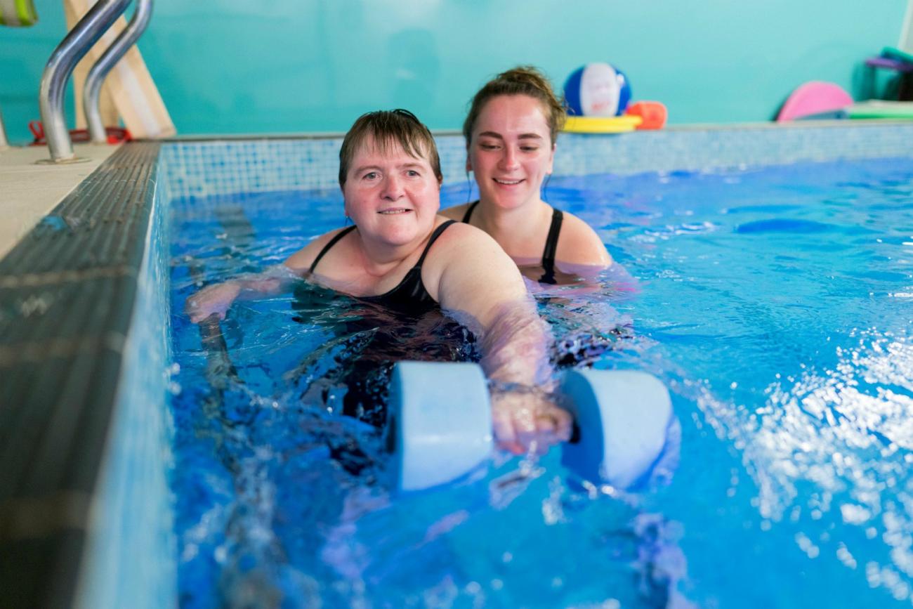 Gloucestershire House resident with occupational therapist in the hydrotherapy pool