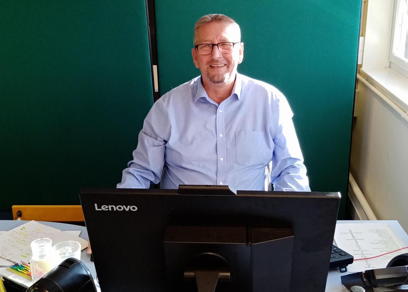 Gregor in the office smiling