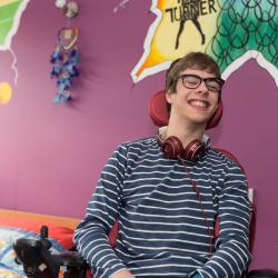 Resident in bedroom at No.1 Lavender Fields