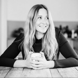 A black and white photo of Anna Jones in the kitchen
