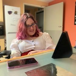 Natalie using a virtual assistant speaker