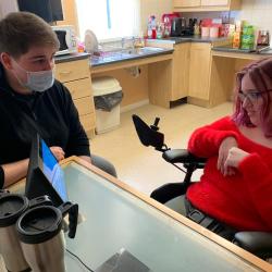 Natalie talks to a member of staff