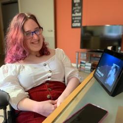 Natalie smiles at the camera