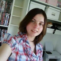 A selfie of a young woman in her bedroom