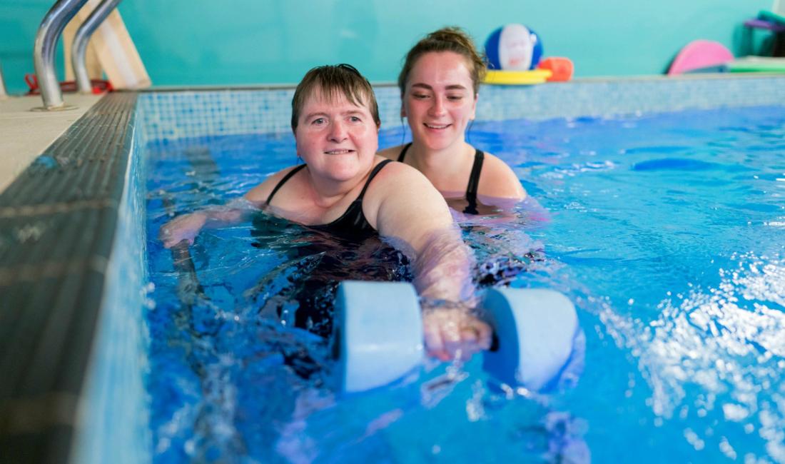 Gloucestershire House resident with occupational therapist in the hydrotherapy pool