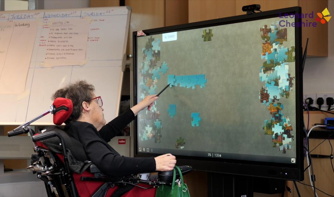 Resident using a piece of accessible technology