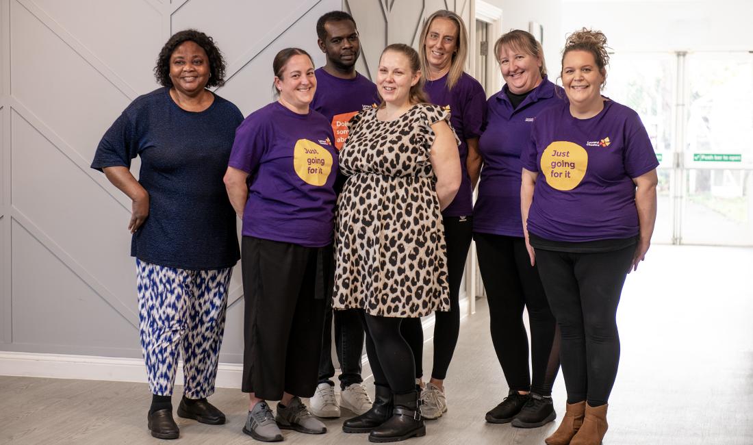 A group of Leonard Cheshire Workers stood together 